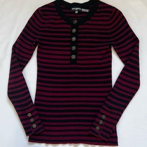 Carl Lagerfield/Paris Henley knit top with a plaque and three buttons on sleeve